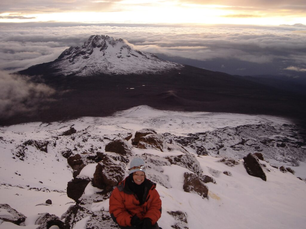 Laura Williams along mountain ridge of Mt. Kilimanjaro. Sorry, not sorry blog.
